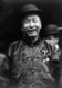 USA: Smiling Chinese man. New York Chinatown, 1915
